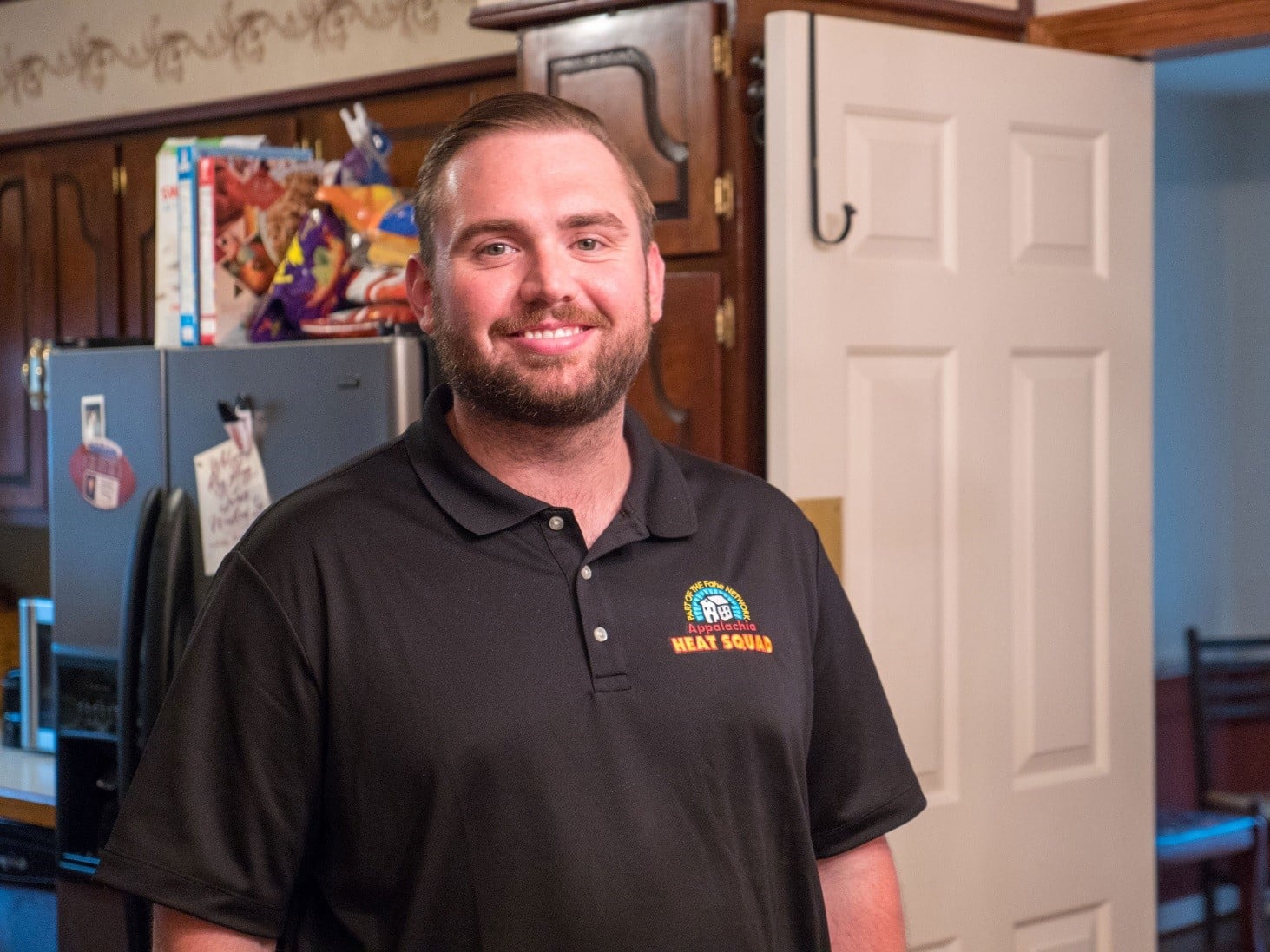 Appalachia HEAT Squad Relationship Manager Tyler Johnson on site during an AHS energy audit.