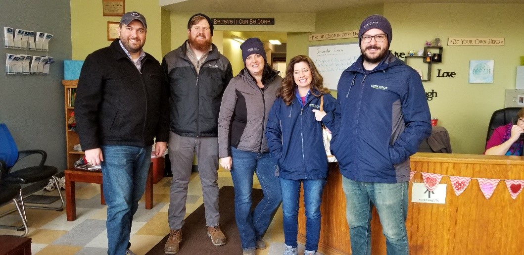 KHC's Executive Director, Edwin King, and Welcome House's Executive Director, Danielle Amrine, with a few of Welcome House of Northern Kentucky's staff.