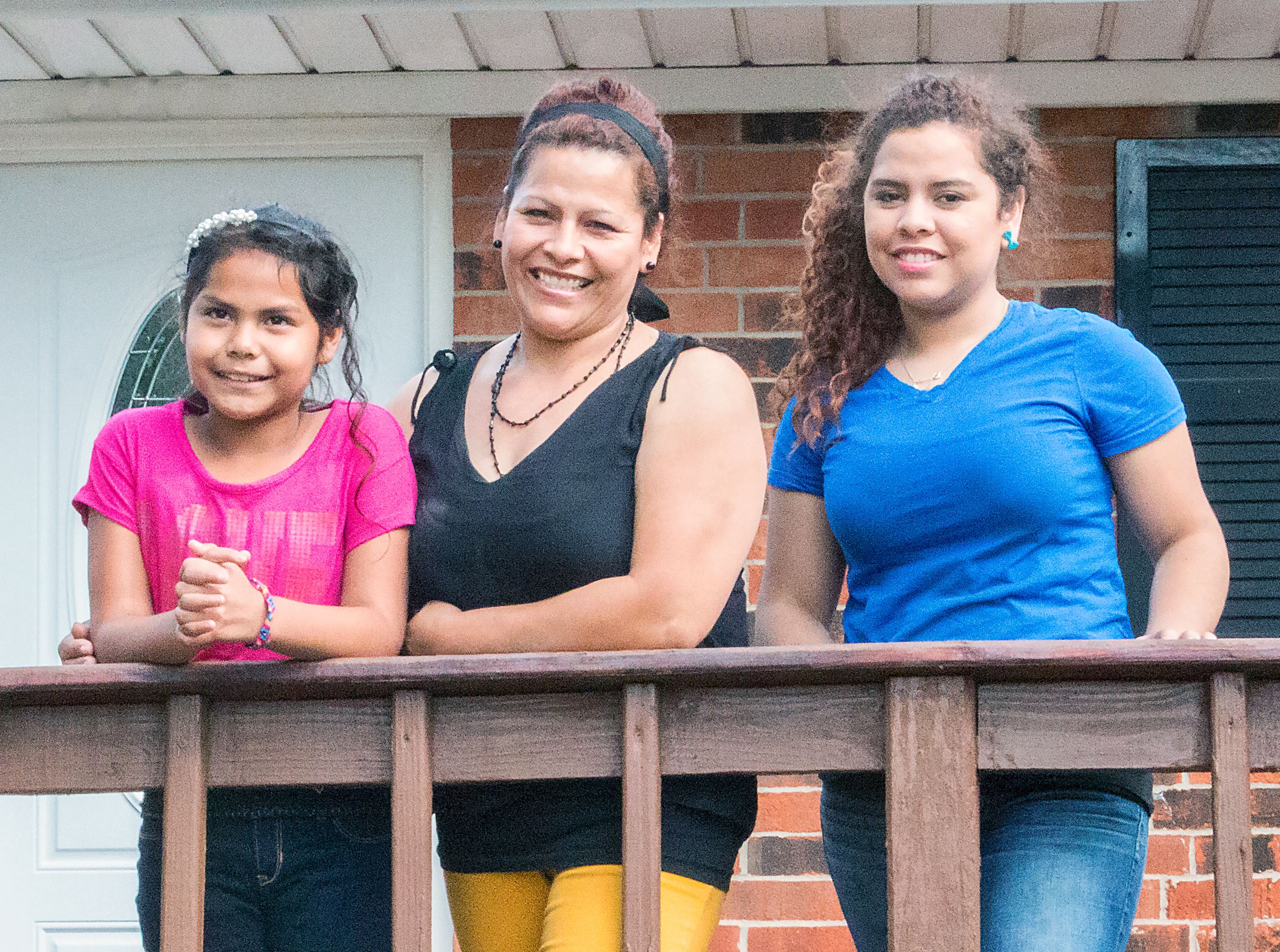 Tomasa Sanchez and children outside their new home.